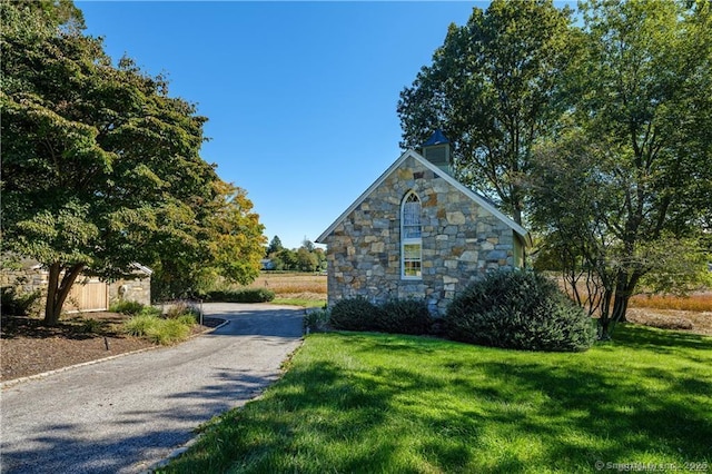 view of home's exterior featuring a lawn