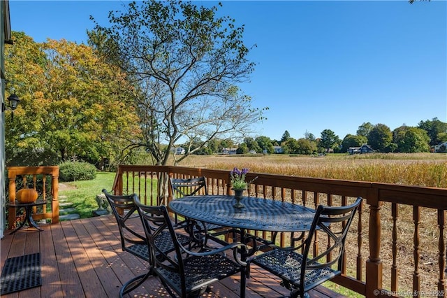 wooden deck featuring a rural view