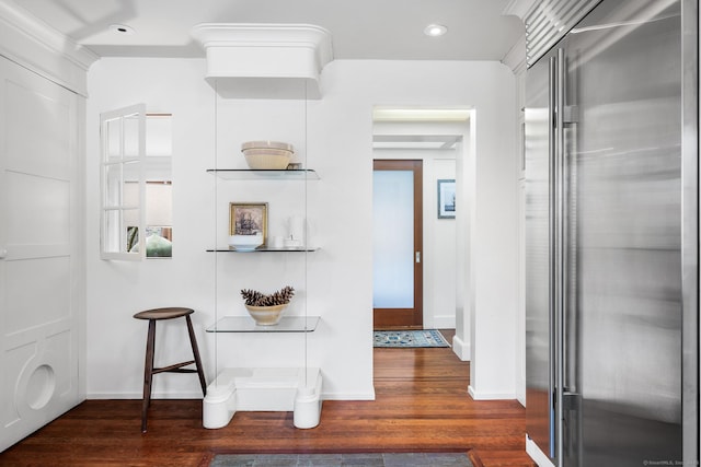 kitchen with stainless steel built in fridge and dark hardwood / wood-style flooring