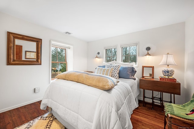 bedroom featuring dark wood-type flooring