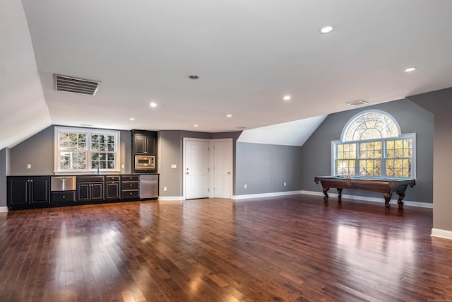 unfurnished living room with dark wood-type flooring, billiards, and vaulted ceiling