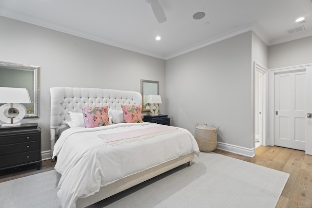 bedroom featuring wood-type flooring, ceiling fan, and ornamental molding