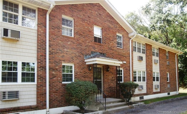 view of property featuring a wall unit AC