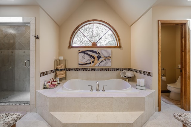 bathroom featuring tile patterned flooring, shower with separate bathtub, toilet, and lofted ceiling