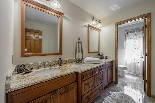 bathroom with vanity and toilet