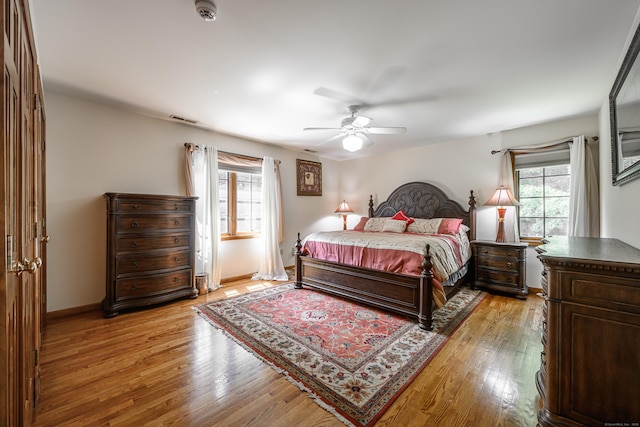 bedroom featuring ceiling fan and light hardwood / wood-style floors