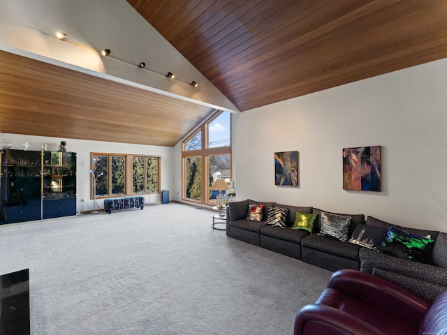 carpeted living room with high vaulted ceiling and wooden ceiling