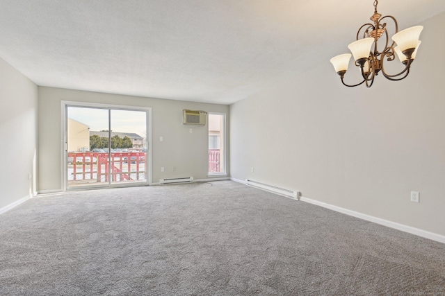 empty room featuring a notable chandelier, carpet floors, a wall unit AC, and baseboard heating