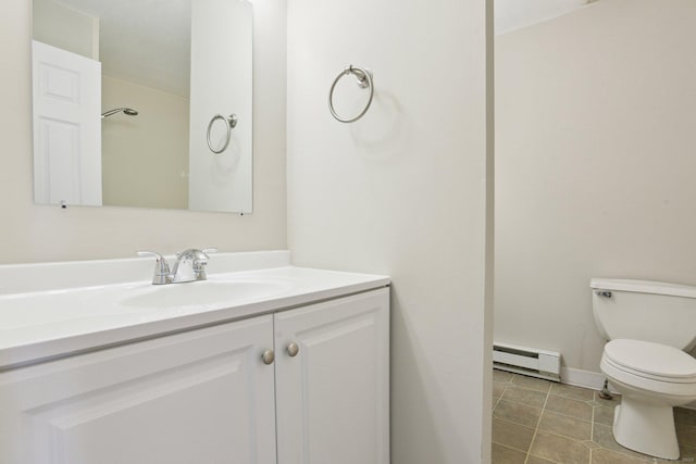 bathroom featuring vanity, a baseboard radiator, and toilet