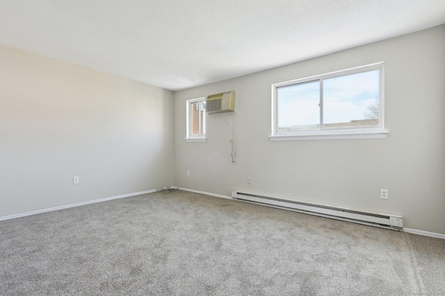 empty room with carpet floors, a baseboard heating unit, a wall mounted air conditioner, and plenty of natural light