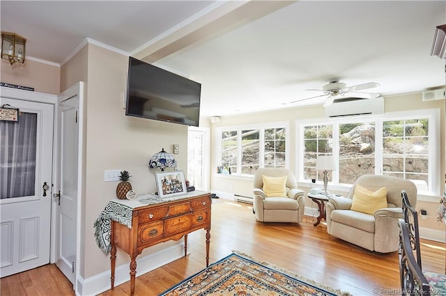 interior space featuring ceiling fan, a healthy amount of sunlight, light wood-type flooring, and a wall mounted air conditioner