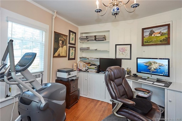 office space featuring light wood-type flooring, a wealth of natural light, a chandelier, and crown molding