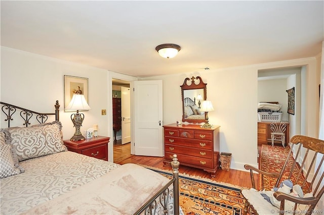 bedroom featuring hardwood / wood-style floors