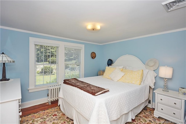 bedroom featuring crown molding, dark hardwood / wood-style floors, and radiator heating unit