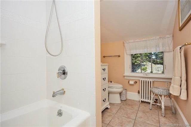 bathroom with toilet, radiator, tile patterned floors, and shower / washtub combination