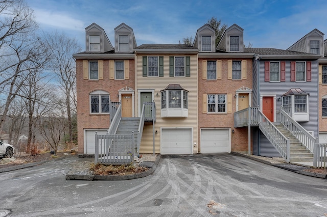 townhome / multi-family property featuring a garage