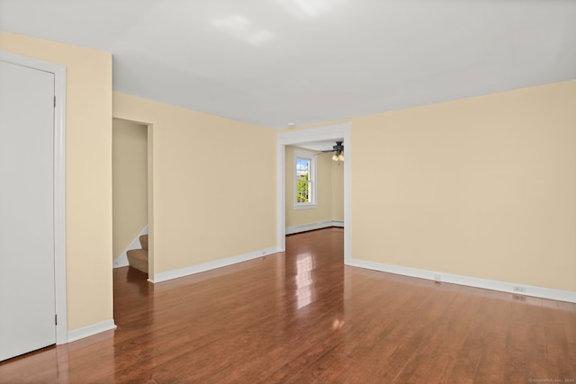 unfurnished room with baseboard heating, ceiling fan, and hardwood / wood-style floors