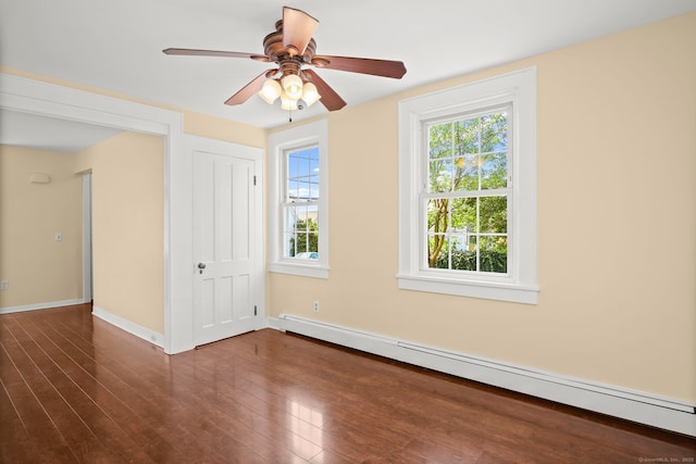 unfurnished bedroom with ceiling fan, a closet, dark hardwood / wood-style floors, and a baseboard heating unit