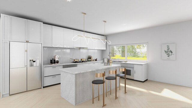 kitchen featuring white fridge with ice dispenser, white cabinets, a center island, hanging light fixtures, and wall oven