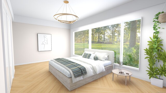 bedroom with light parquet floors and multiple windows