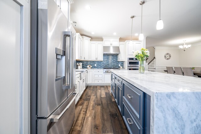 kitchen featuring white cabinetry, appliances with stainless steel finishes, blue cabinets, and pendant lighting