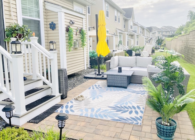 view of patio with a residential view and an outdoor hangout area