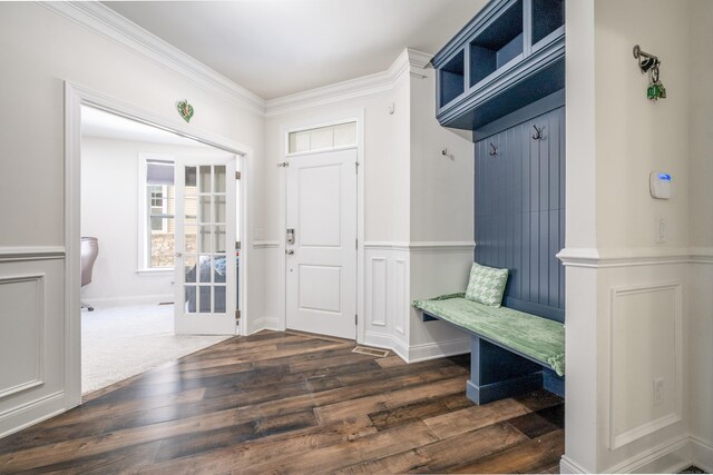 mudroom with dark hardwood / wood-style flooring and crown molding