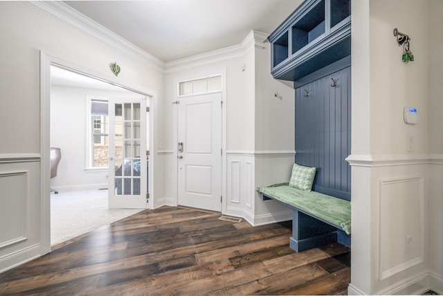 mudroom featuring baseboards, dark wood-type flooring, and crown molding