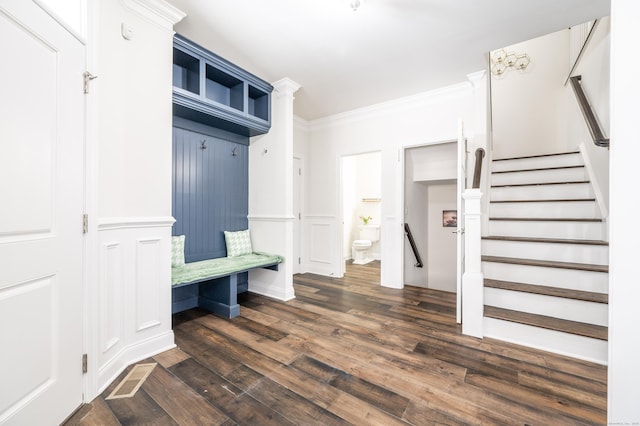 mudroom featuring crown molding and dark wood-type flooring