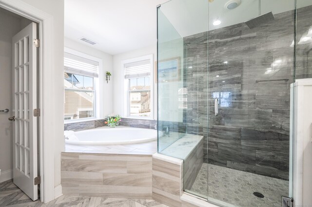 bathroom with independent shower and bath