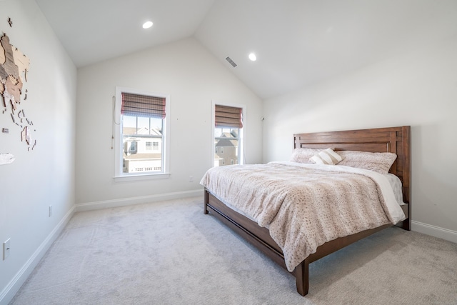 carpeted bedroom featuring vaulted ceiling