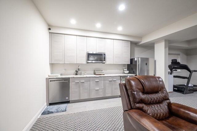 kitchen with white cabinetry, appliances with stainless steel finishes, and sink