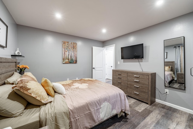 bedroom with hardwood / wood-style floors