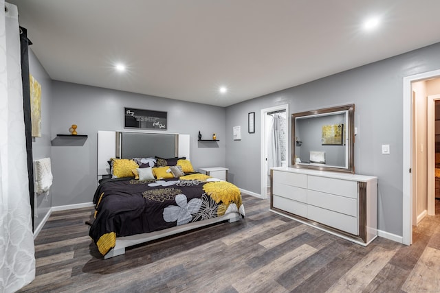 bedroom with hardwood / wood-style floors