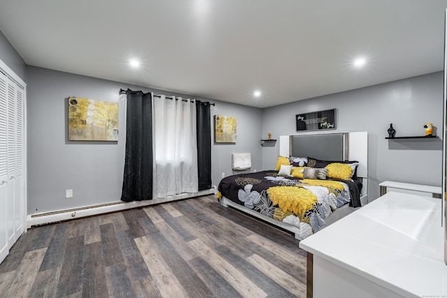 bedroom featuring dark hardwood / wood-style flooring and baseboard heating