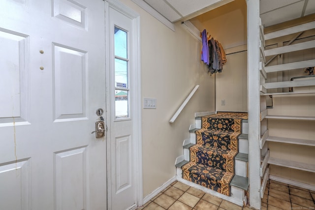 foyer entrance featuring light tile patterned flooring