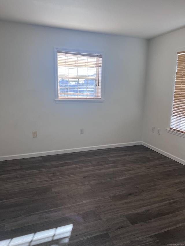 unfurnished room featuring dark hardwood / wood-style floors