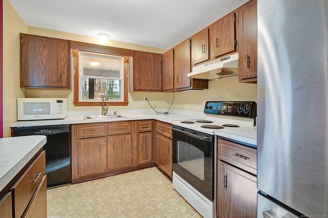 kitchen featuring sink and white appliances