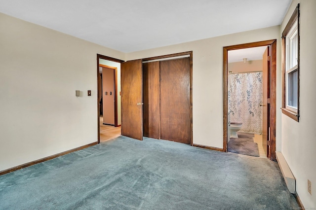 unfurnished bedroom featuring light carpet, a closet, and connected bathroom