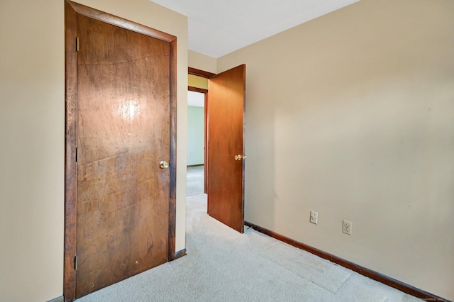 bedroom with light carpet