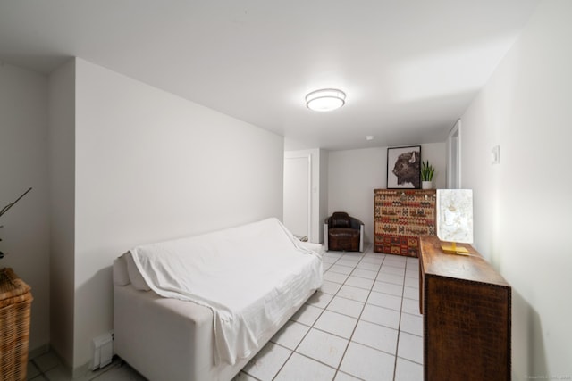 bedroom with light tile patterned floors