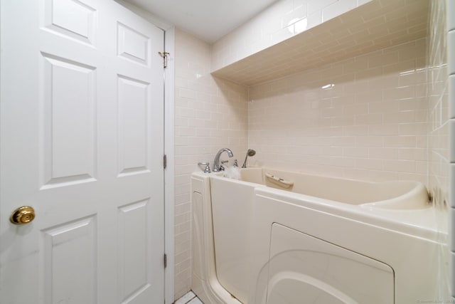 bathroom featuring a tub