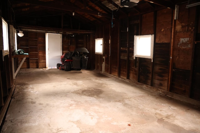 garage with wooden ceiling and a garage door opener