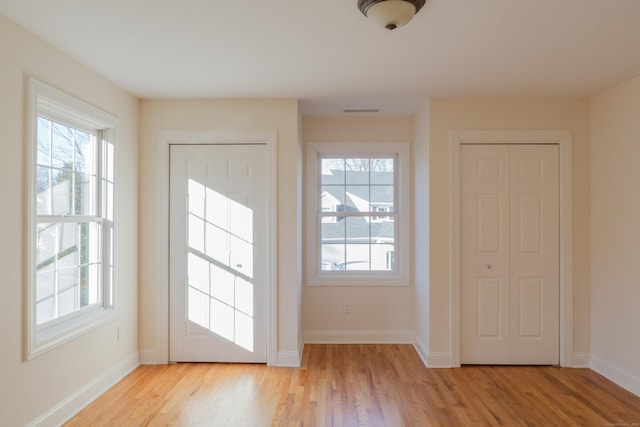 doorway with light hardwood / wood-style floors