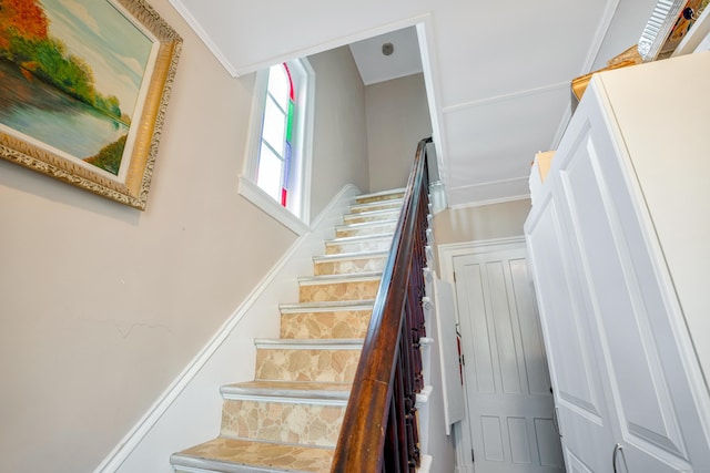 stairs featuring ornamental molding