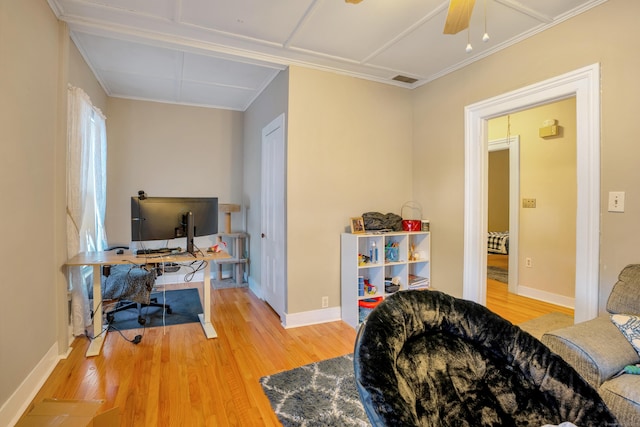 home office with hardwood / wood-style flooring and ceiling fan