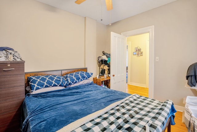 bedroom featuring ceiling fan and light hardwood / wood-style flooring