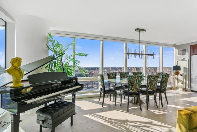 misc room featuring an inviting chandelier and floor to ceiling windows