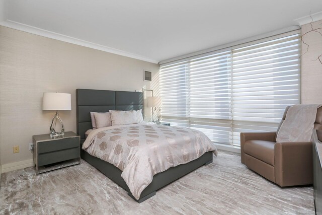 bedroom with ornamental molding