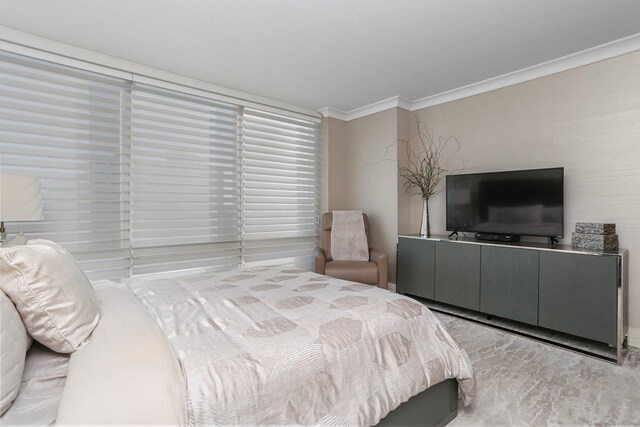 bedroom featuring crown molding